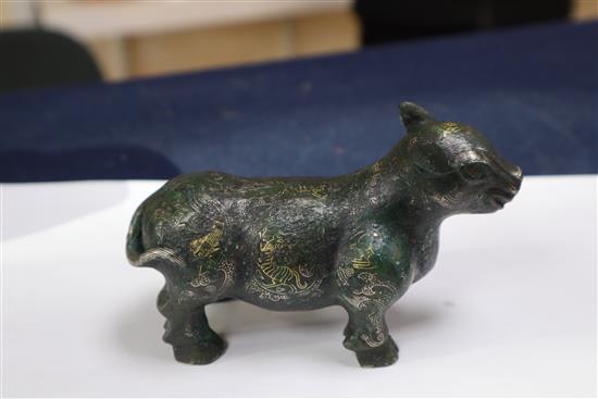 A Chinese gold and silver inlaid bronze figure of a tapir, Han dynasty or later, L. 12cm, excluding hardwood stand and fitted box